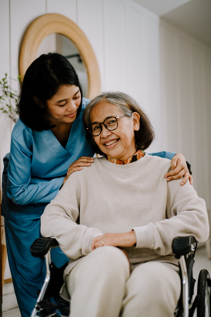 Nurse Taking Care of an Elderly Woman
